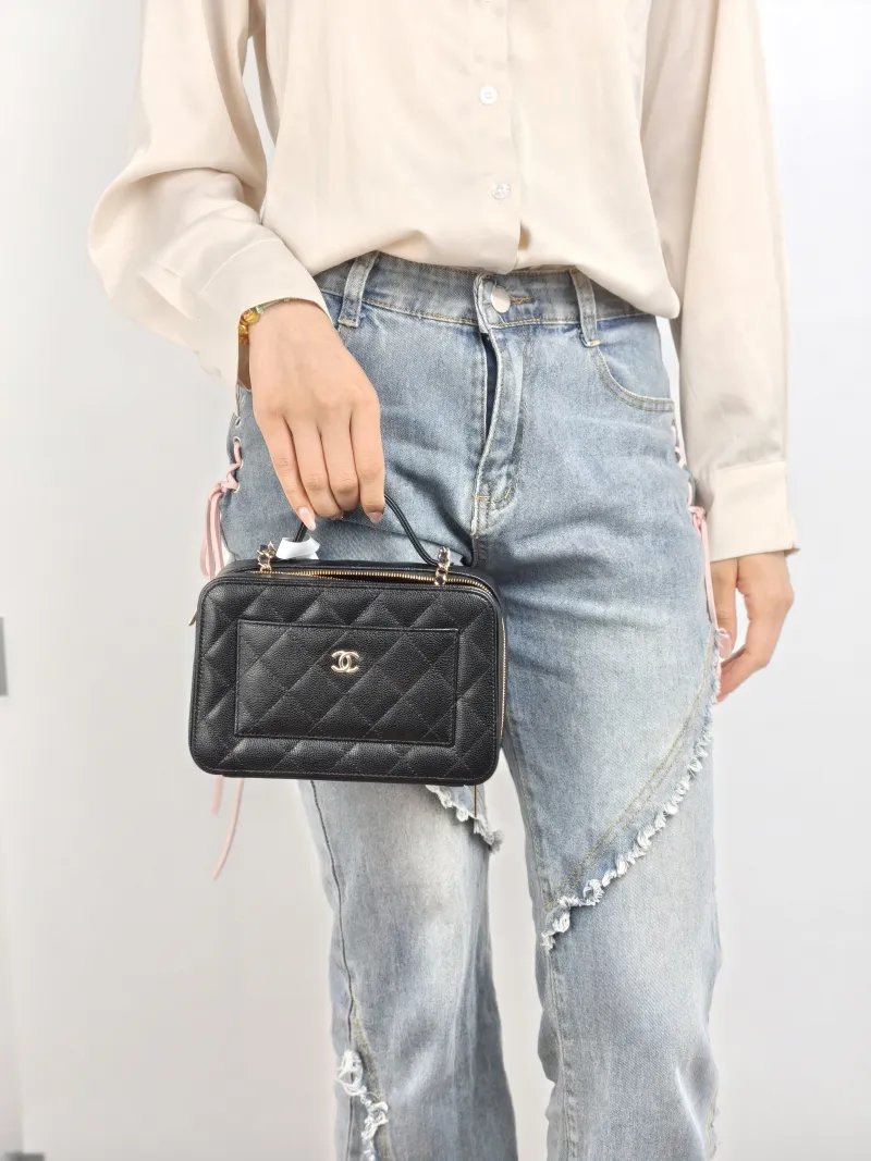 Chanel Crossbody Bag Black Grained Calfskin Mini 19.5 × 8.5 × 12 cm — on-model view 1 of 2