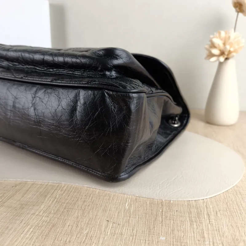 SAINT LAURENT Crossbody Bag Niki Black Calfskin Large 32 × 9 × 23 cm — detail view 2 of 13