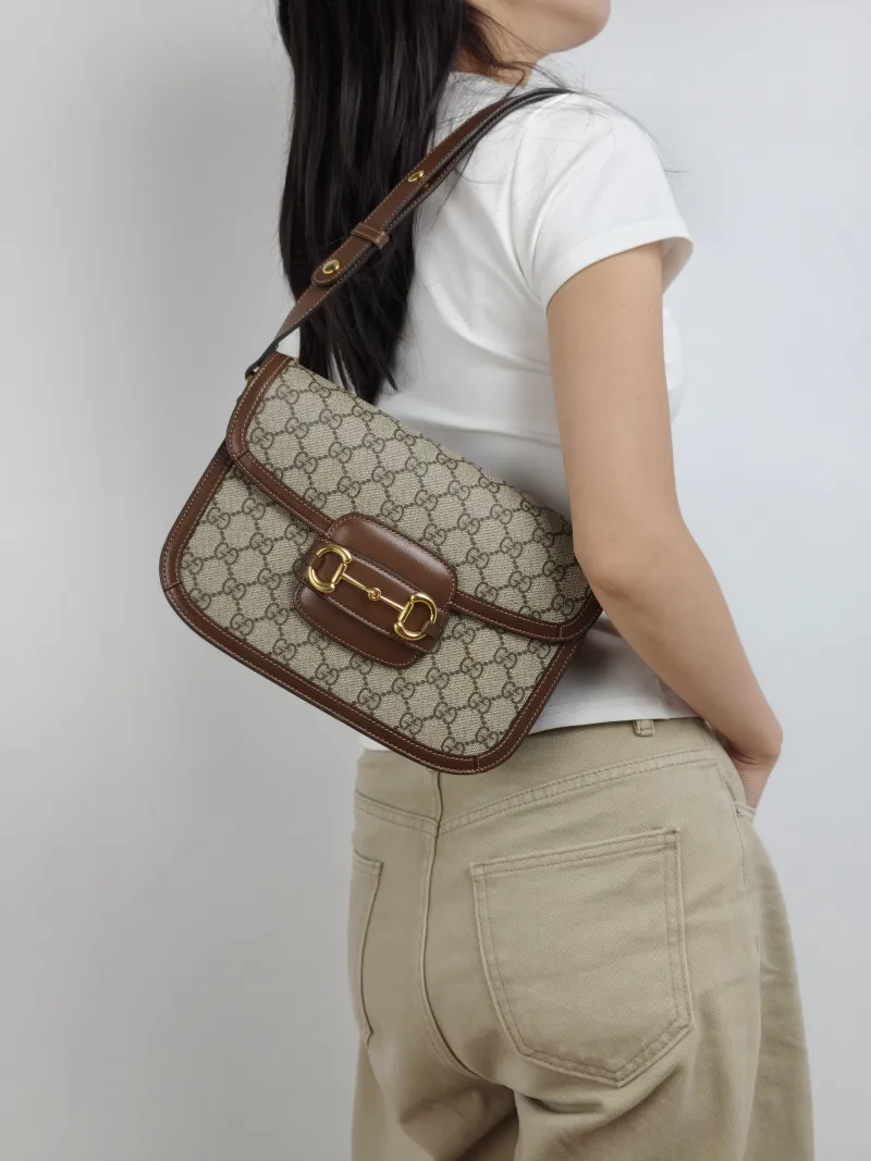 GUCCI Shoulder Bag Horsebit 1955 Horsebit Medium Monogram PVC Medium 25 × 8 × 18 cm — on-model view 1 of 3