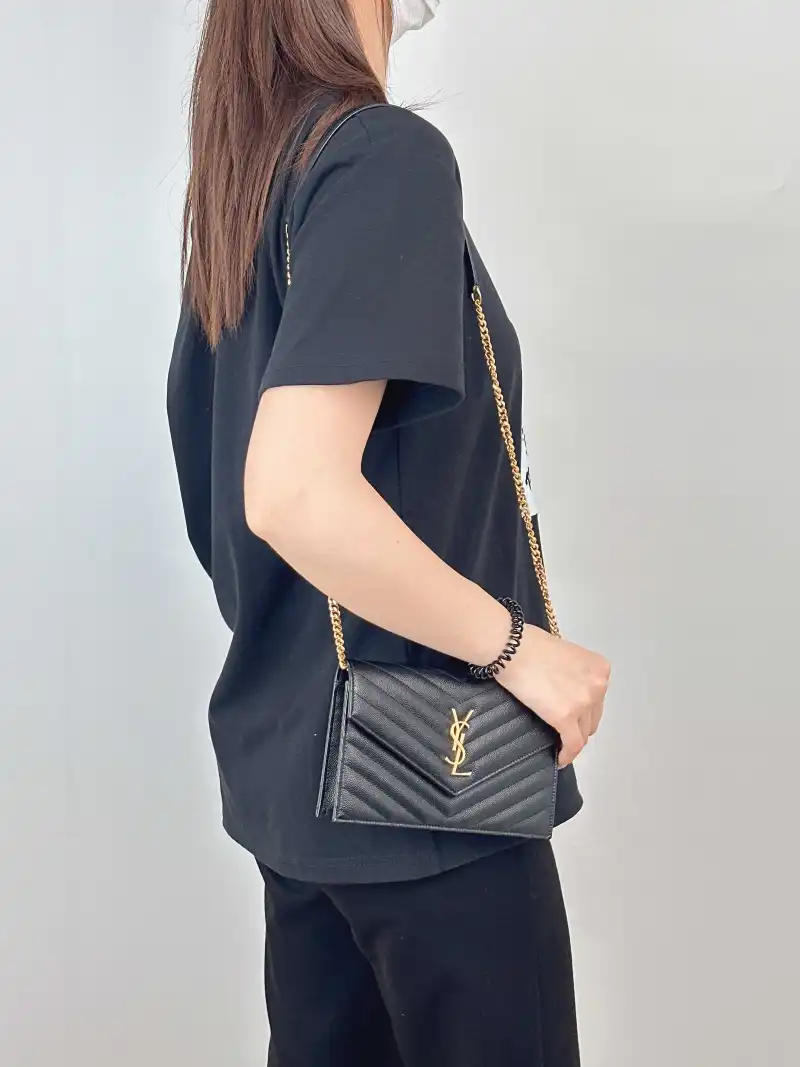 SAINT LAURENT Crossbody Bag CASSANDRE ENVELOPE Black Calfskin One Size 19 × 3.5 × 12.5 cm — on-model view 1 of 3