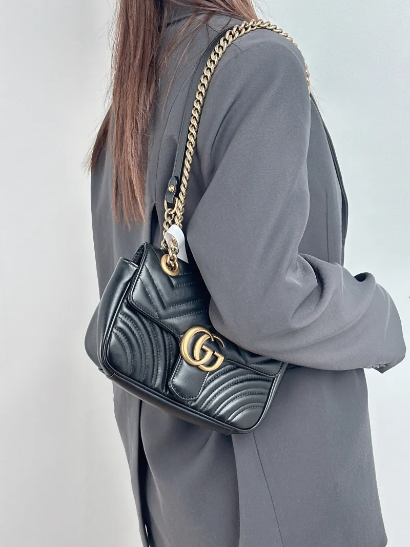 GUCCI Crossbody Bag GG Marmont Small Marmont 22 Black CC alfskin Small 22 × 6 × 13 cm — on-model view 1 of 2
