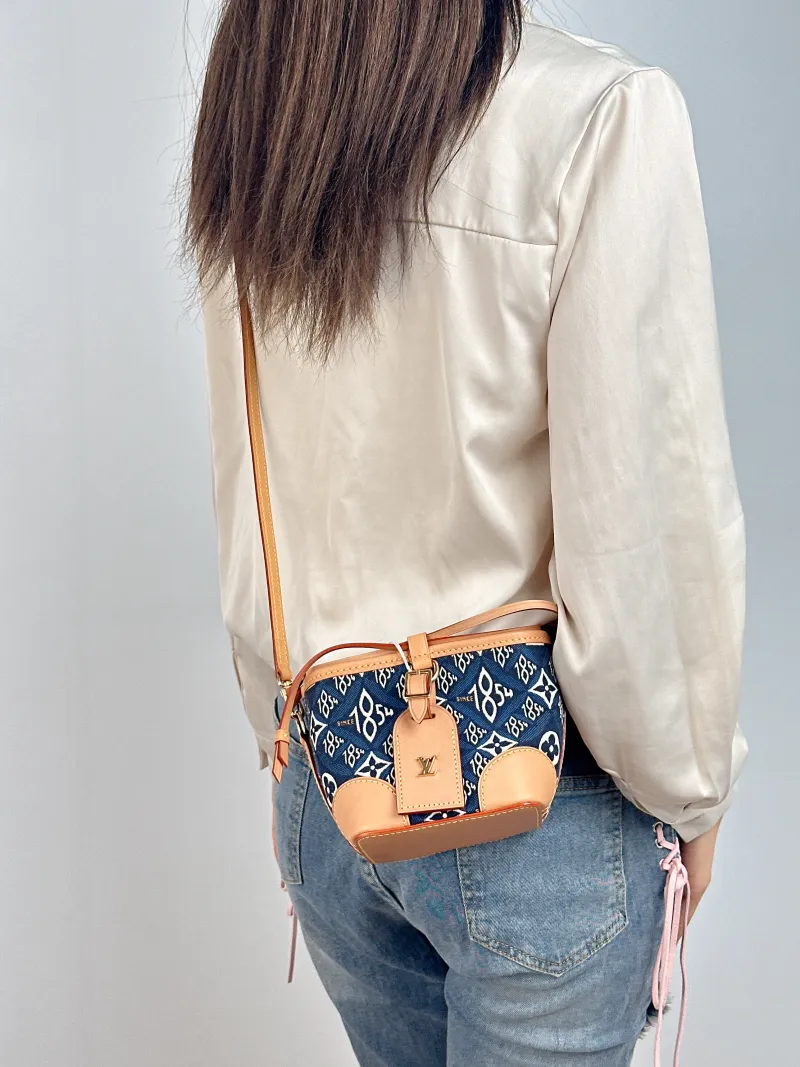 Louis Vuitton Crossbody Bag NOÉ PURSE 1854 Mini 11.5 × 11.5 × 12 cm — on-model view 1 of 2