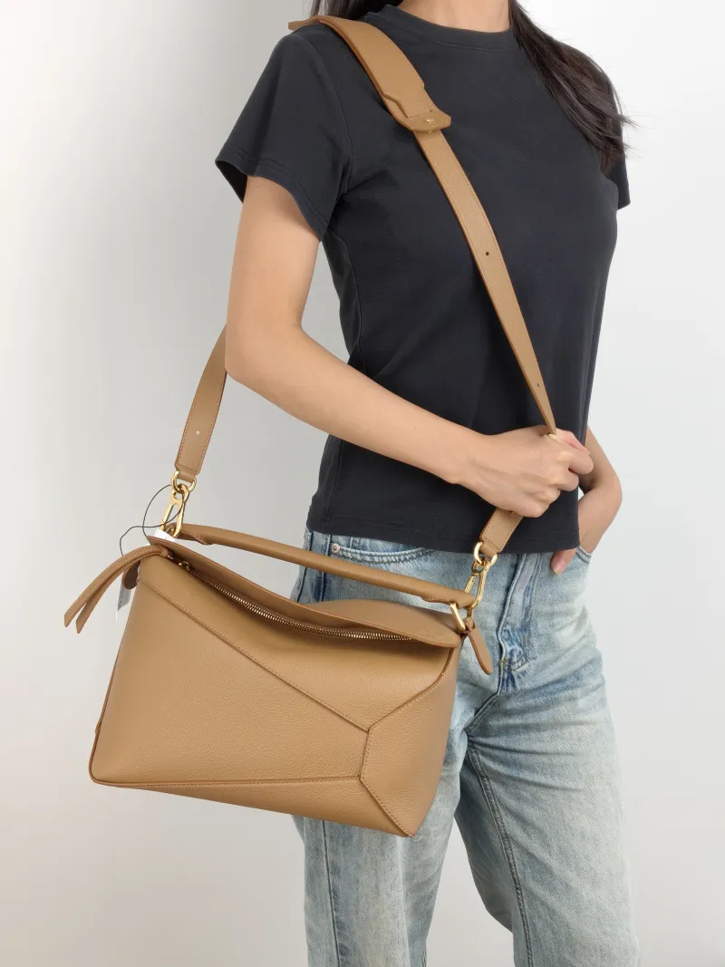 LOEWE Shoulder Bag Puzzle Brown CC alfskin Medium 29 × 14 × 19.5 cm — on-model view 2 of 3