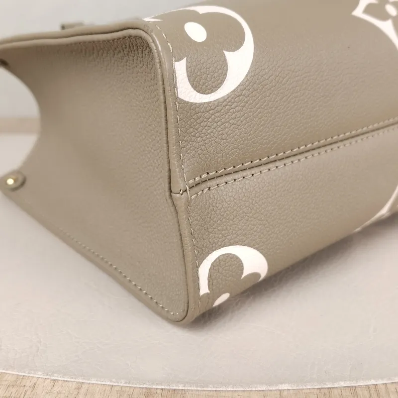 Louis Vuitton Top Handle Bag Onthego Monogram Empreinte Embossed Calfskin Small 25 × 11.5 × 19 cm — detail view 3 of 10