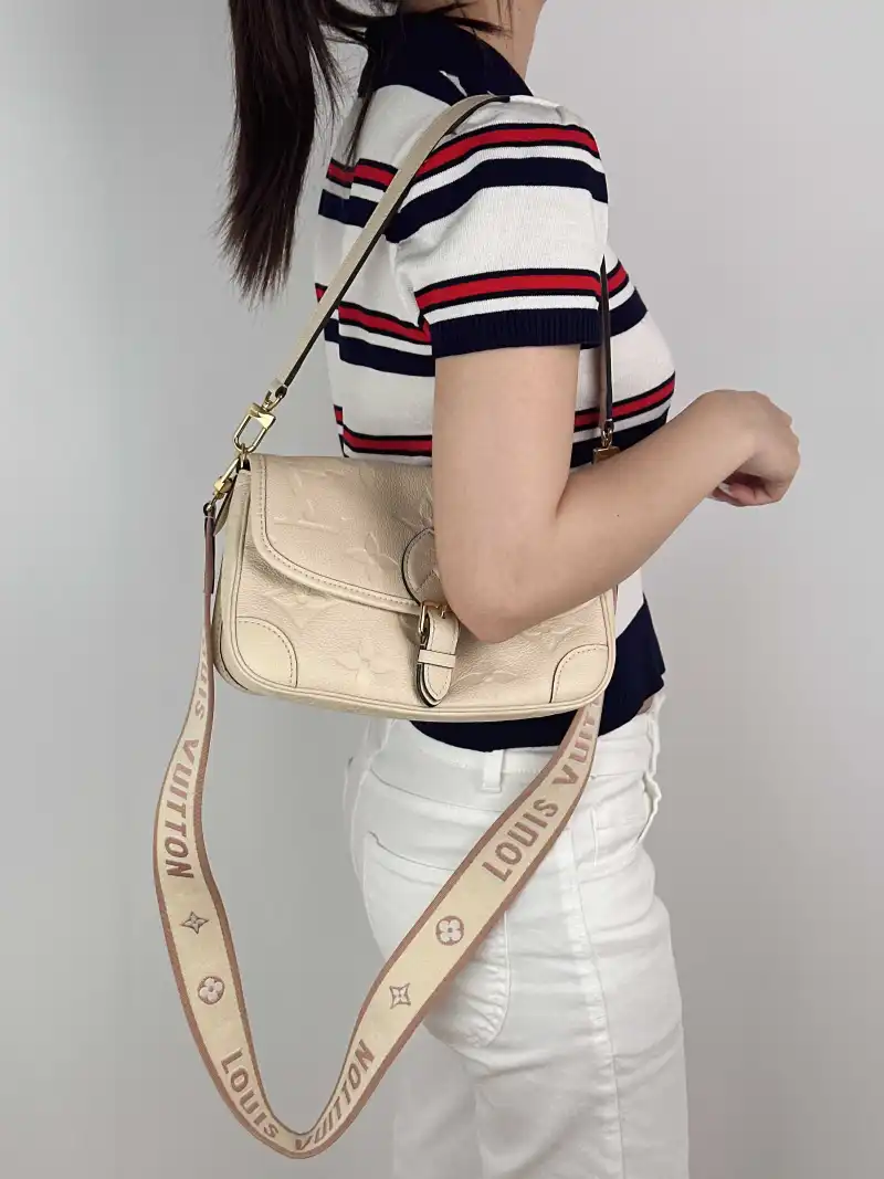 Louis Vuitton Crossbody Bag Diane Baguette Bag White Monogram Empreinte Embossed Calfskin Small 24 × 9 × 15 cm — on-model view 3 of 3