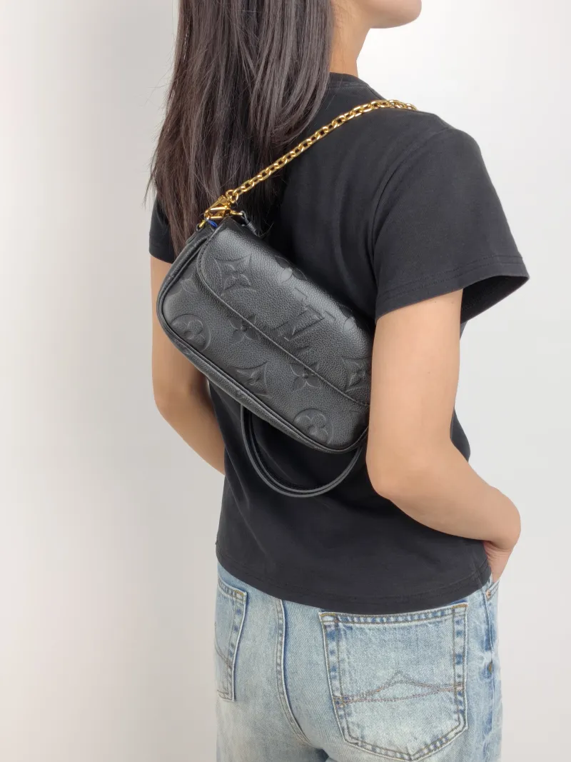 Louis Vuitton Crossbody Bag IVY Black Empreinte Embossed Calfskin Small 23.5 × 4.3 × 12 cm — on-model view 2 of 3