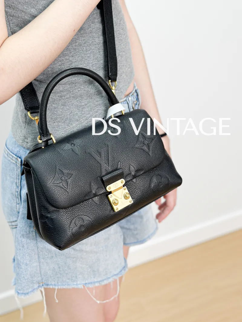 Louis Vuitton Crossbody Bag MADELEINE Black Empreinte Embossed Calfskin BB 24 × 8.5 × 17 cm — on-model view 2 of 3