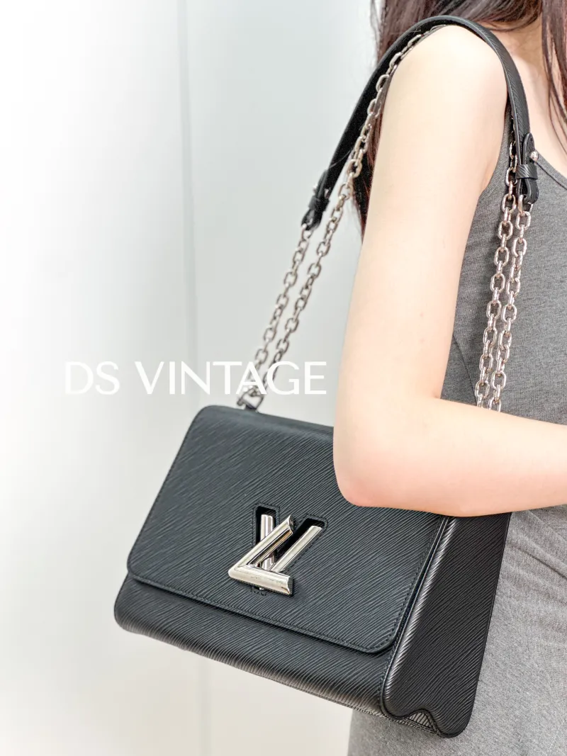 Louis Vuitton Crossbody Bag Twist Black Epi Embossed Calfskin Medium 23 × 9.5 × 17 cm — on-model view 1 of 3