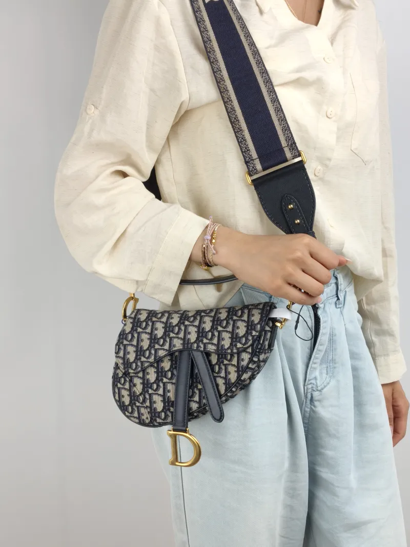 DIOR Top Handle Bag Saddle Blue Canvas Mini 19 × 6 × 15 cm — on-model view 1 of 2