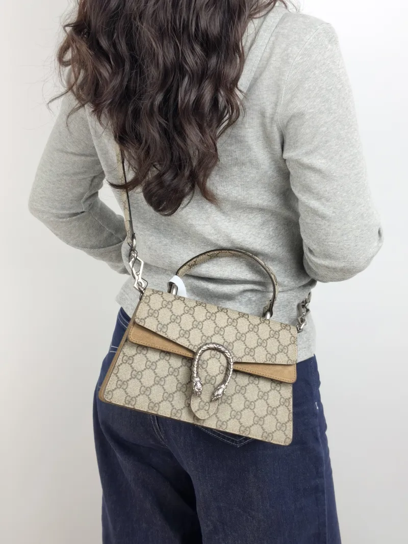 GUCCI Crossbody Bag Dionysus Edition Monogram PVC Small 24.5 × 10 × 15.5 cm — on-model view 2 of 3
