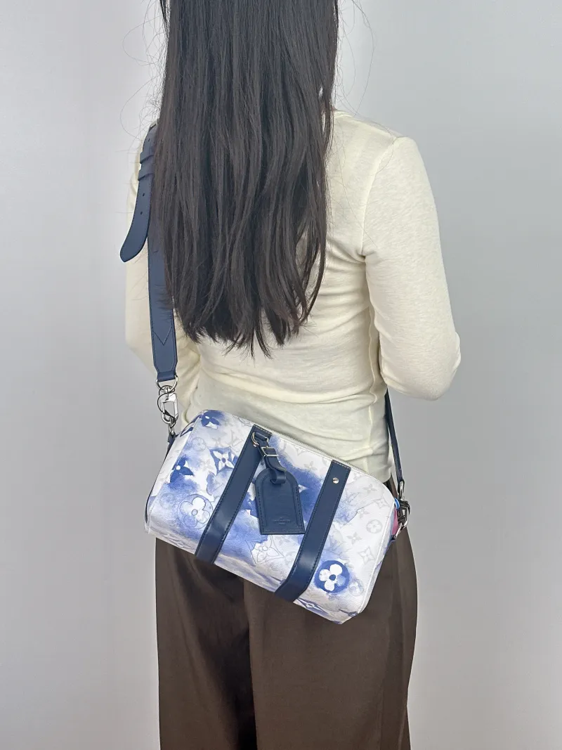 Louis Vuitton Crossbody Bag City Keepall PVC Medium 27 × 13 × 17 cm — on-model view 1 of 2