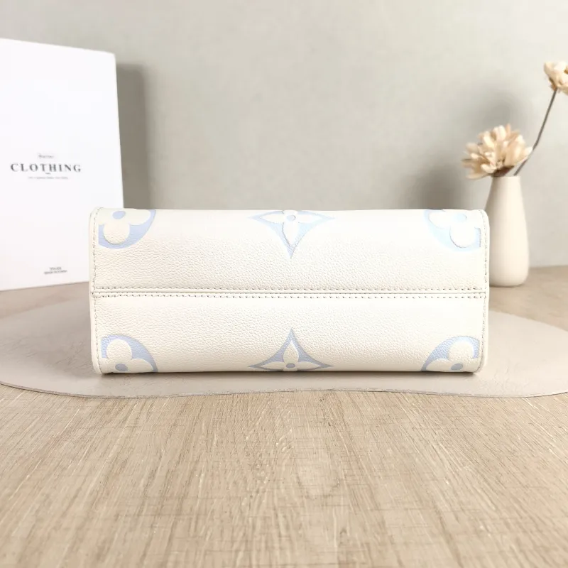 Louis Vuitton Shoulder Bag Onthego White · Blue Monogram Empreinte Embossed Calfskin Small 25 × 11.5 × 19 cm — cover view 5 of 6
