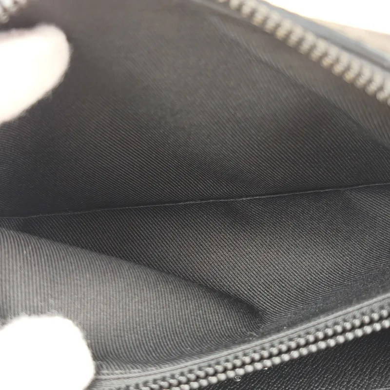 Louis Vuitton TRUNK WALLETHET Box Monogrampvc · Microchip Edition · Shoulder Strap Dust Bag · 22.5 × 5 × 14 cm — on-model view 7 of 10