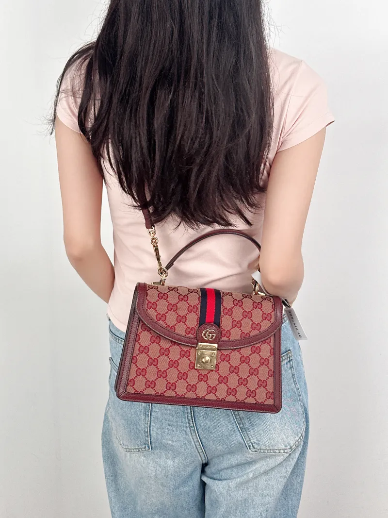 GUCCI Crossbody Bag Ophidia GG Messenger Bag Burgundy Canvas Medium25 × 7 × 17.5 cm — on-model view 2 of 3