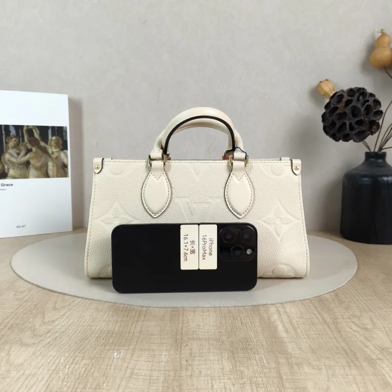 Louis Vuitton Crossbody Bag Onthego East West Two Straps White Empreinte Embossed Calfskin Small 25 × 10 × 13 cm — cover view 5 of 6