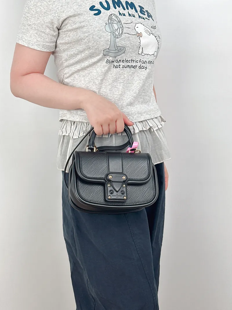 Louis Vuitton Crossbody Bag Hide and Seek Messenger Bag Black Epi Embossed Calfskin One Size21 × 8 × 15 cm — on-model view 1 of 3