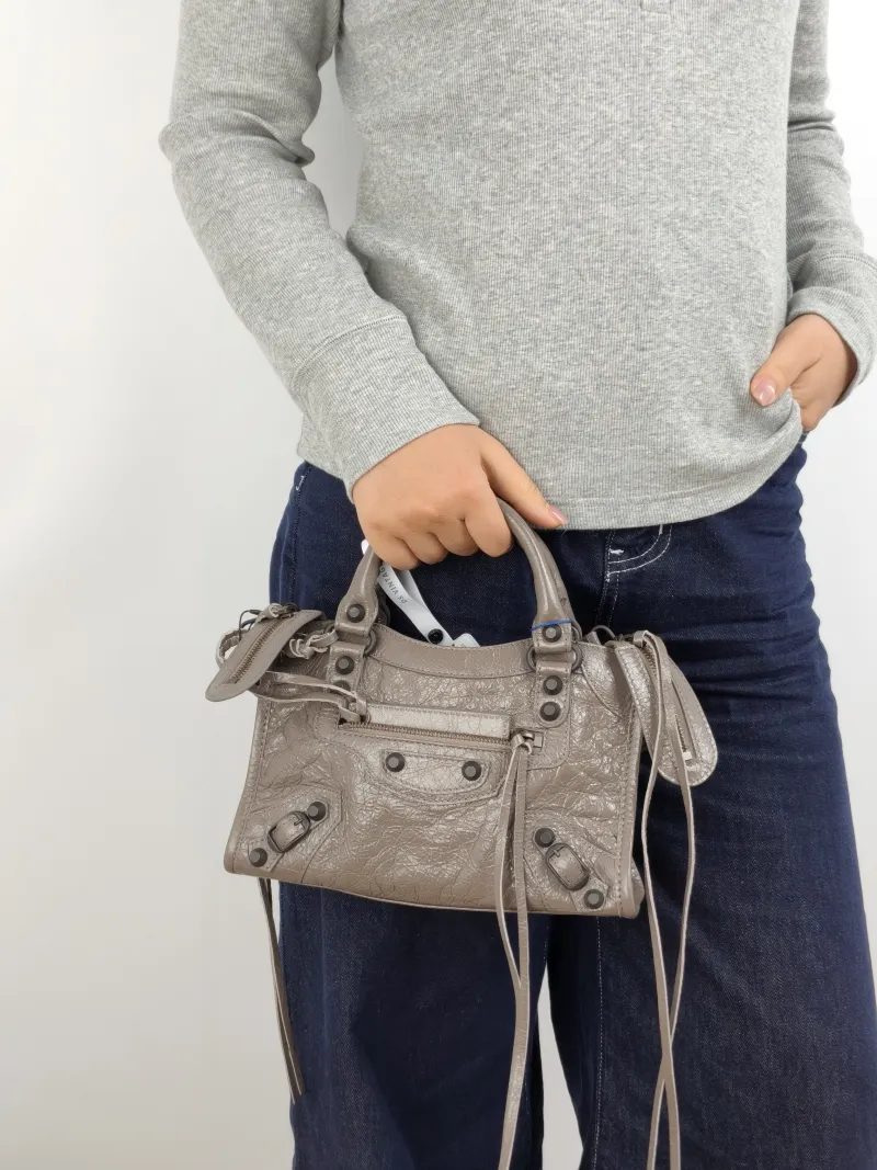 BALENCIAGA Crossbody Bag Classic City Brown Lambskin Mini 24 × 10 × 16 cm — on-model view 1 of 3