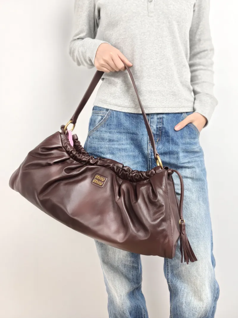 Miumiu Shoulder Bag Joie Shoulder Bag SL ambskin 53 × 9 × 25 cm — on-model view 2 of 2