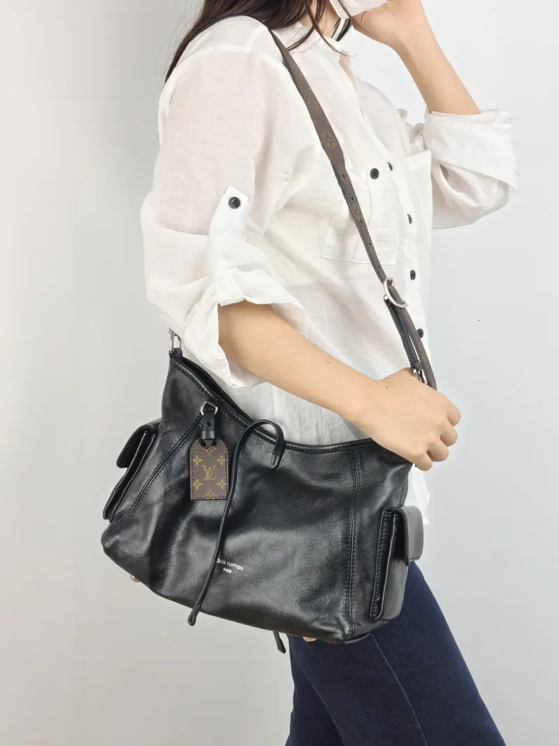 Louis Vuitton Crossbody Bag Carryall Cargo Vibe Black SL ambskin Small 33.5 × 15 × 23 cm — on-model view 1 of 2