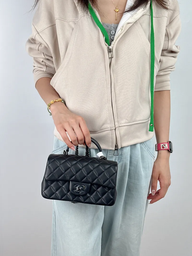Chanel Crossbody Bag mini Black Lambskin mini 20 × 6 × 12 cm — on-model view 1 of 3