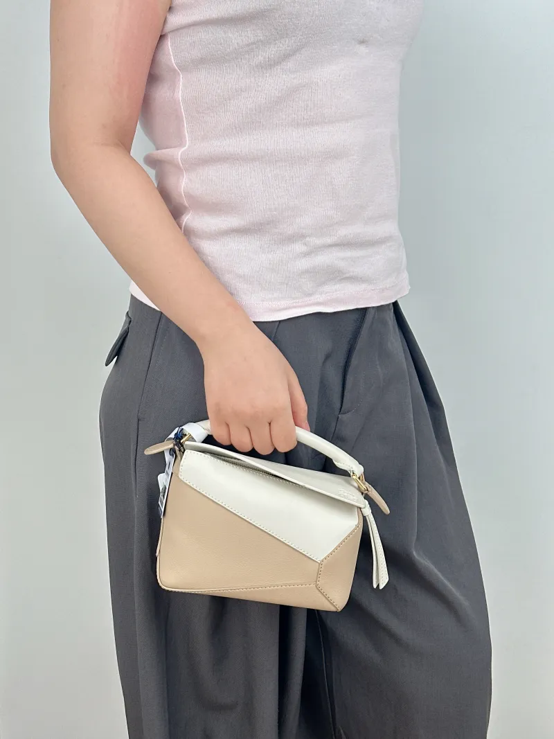 LOEWE Crossbody Bag Puzzle Beige Taupe Calfskin Mini 18 × 8 × 12.5 cm — on-model view 1 of 2