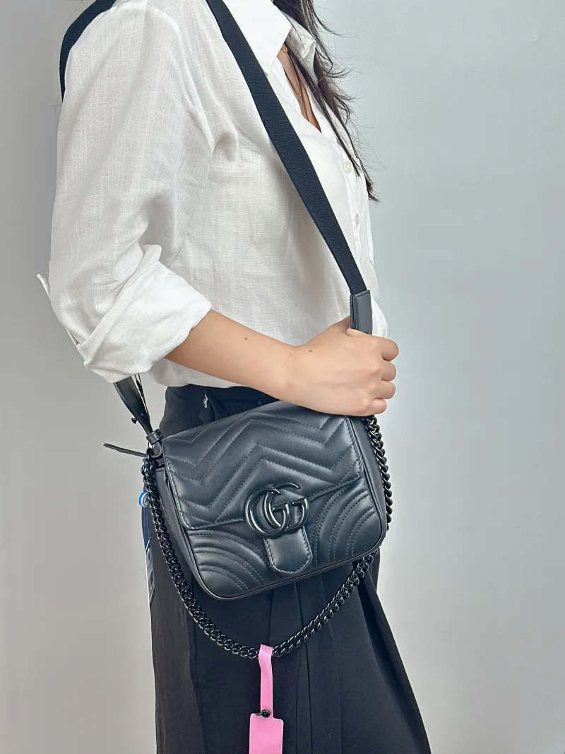 GUCCI Crossbody Bag GG Marmont Marmont Black Calfskin Mini 18 × 8 × 15 cm — on-model view 1 of 2