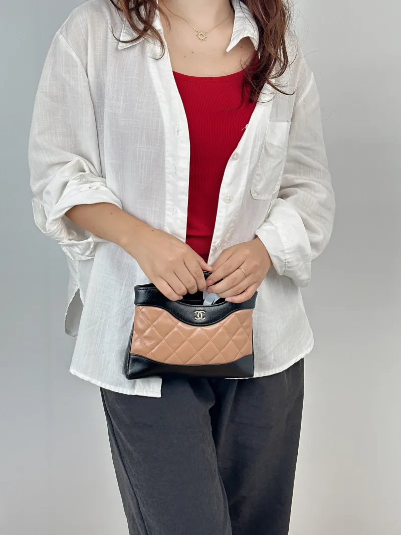 Chanel Crossbody Bag31Bag Beige · Black Waxed Leathernano19 × 5 × 12 cm — on-model view 2 of 2