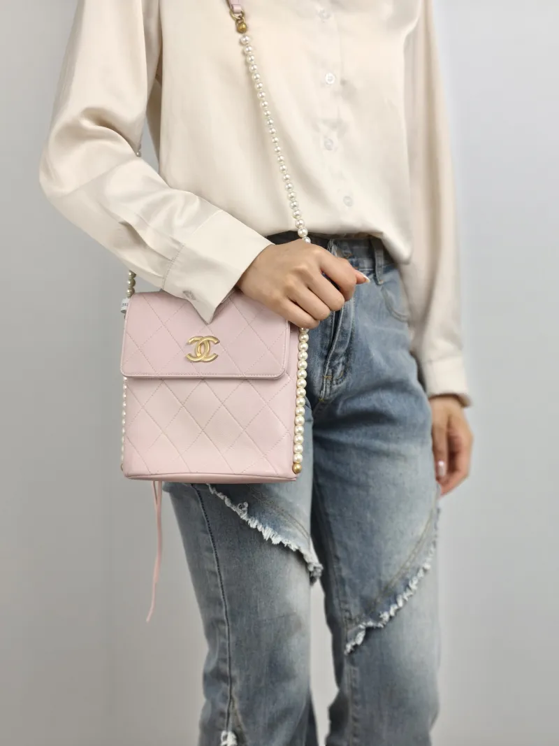 Chanel Crossbody Bag Pearl Crossbody Bag Pink Calfskin One Size 19 × 8 × 19 cm 31 — on-model view 2 of 2