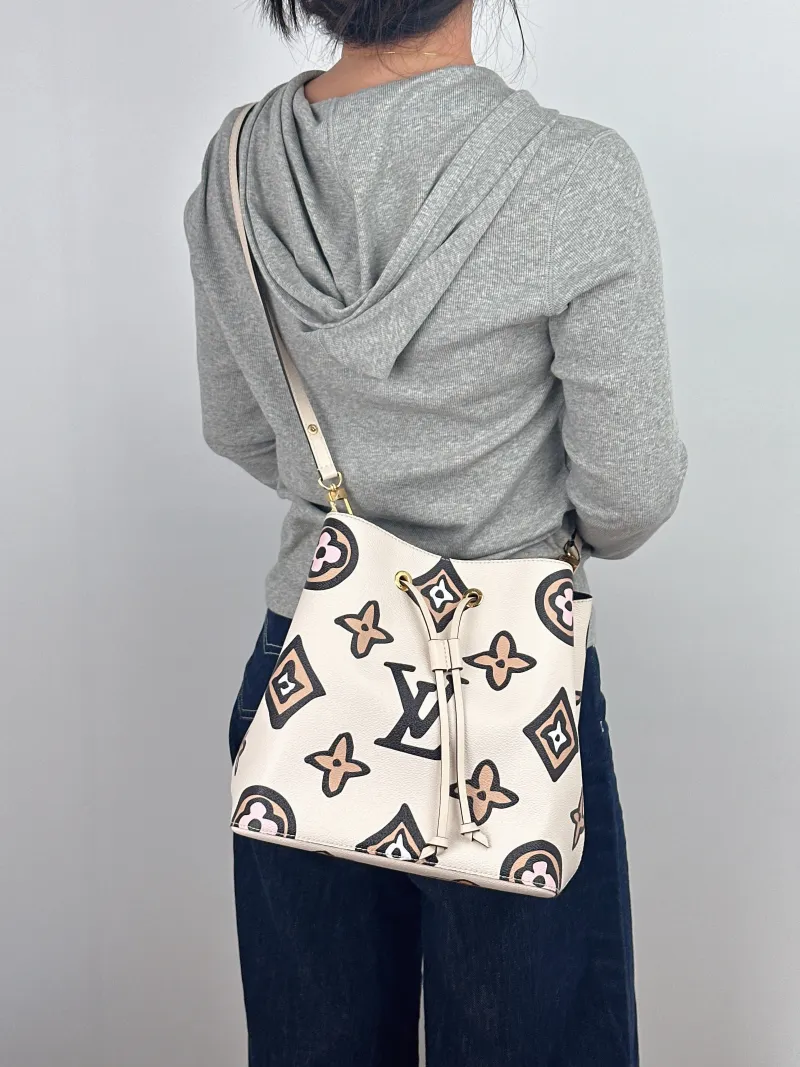 Louis Vuitton Shoulder Bag NÉONOÉ Bucket Bag PVC Medium 26 × 17.5 × 26 cm — on-model view 1 of 2