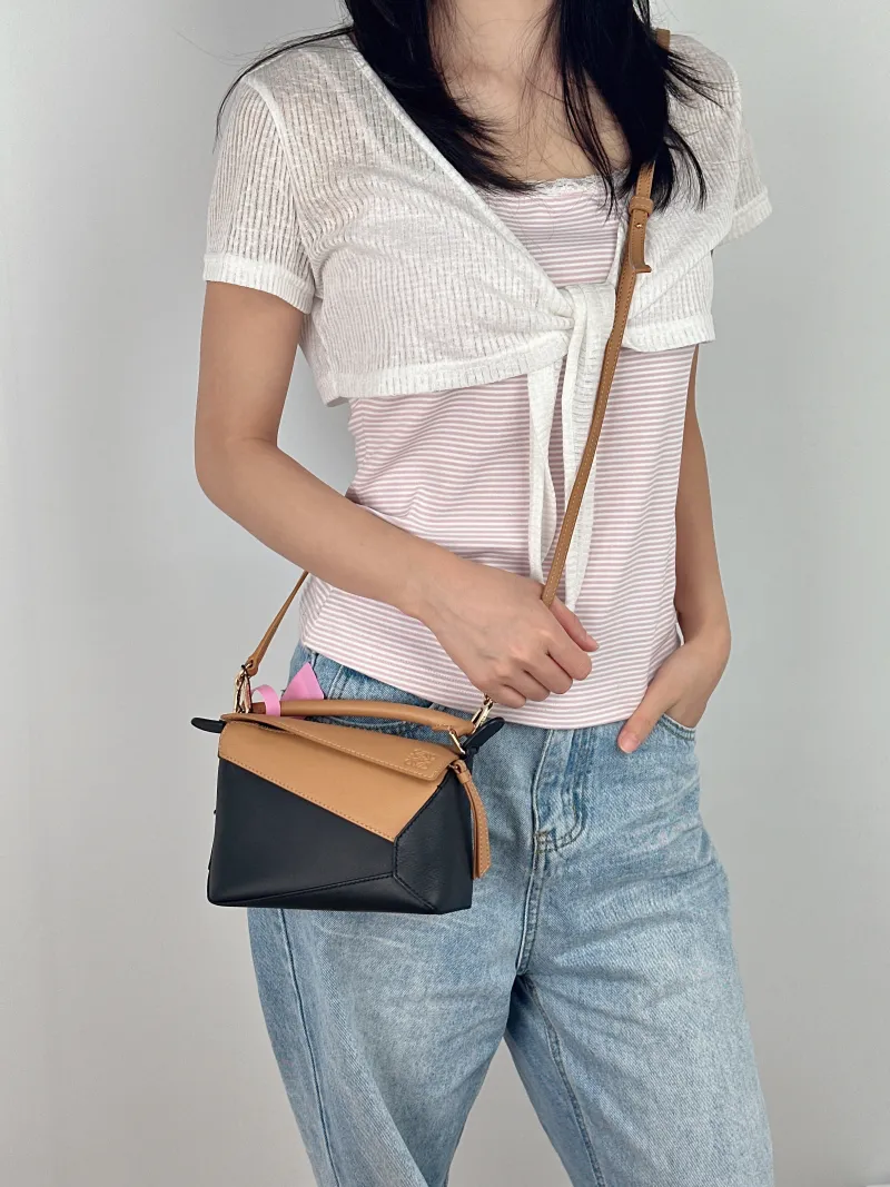 LOEWE Crossbody Bag Puzzle Black Brown Calfskin Mini 18 × 8 × 12.5 cm — on-model view 2 of 3