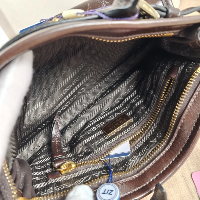 PRADA Top Handle Bag Bonnie Soft Lux Brown Waxed Leather Mini 23.5 × 9 × 12 cm — detail view 3 of 13