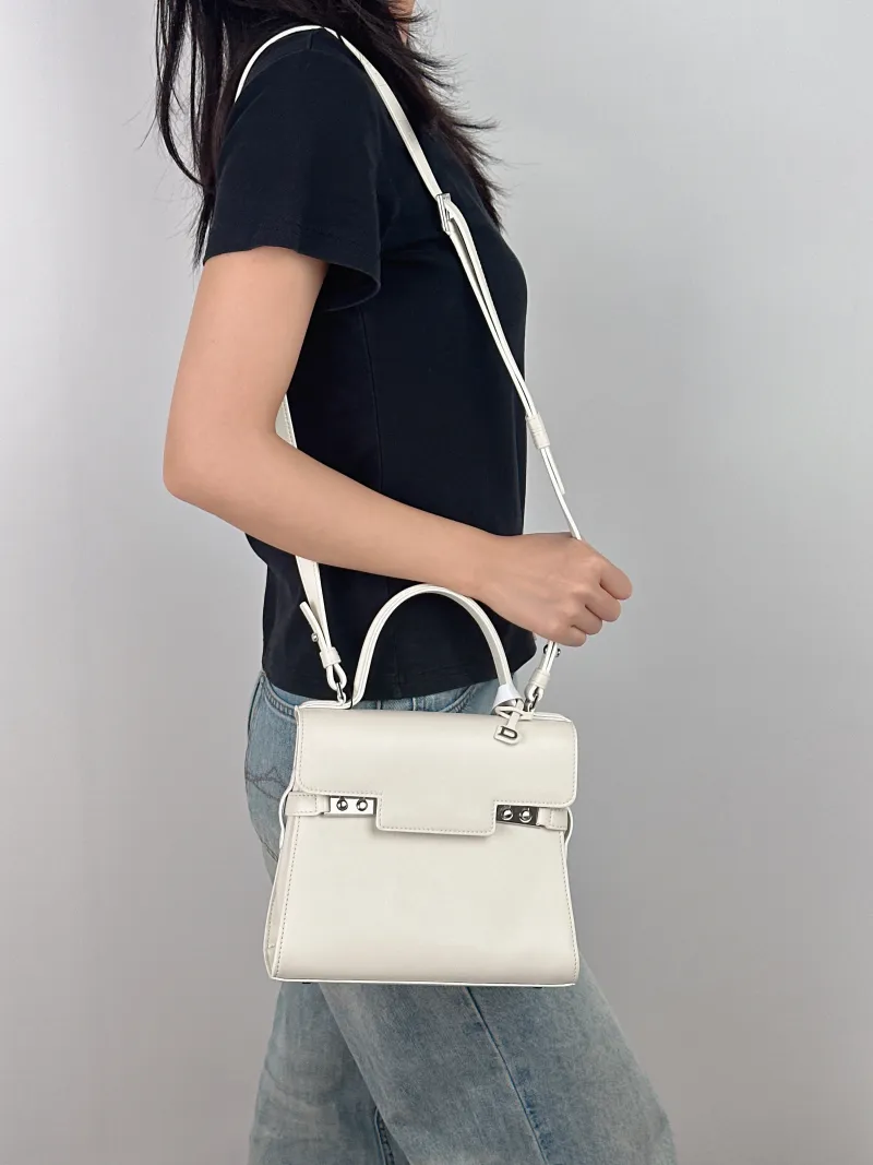 DELVAUX Top Handle Bag Tempete Top Handle Bag White Calfskin Small 21.5 × 8.5 × 19.5 cm — on-model view 1 of 3