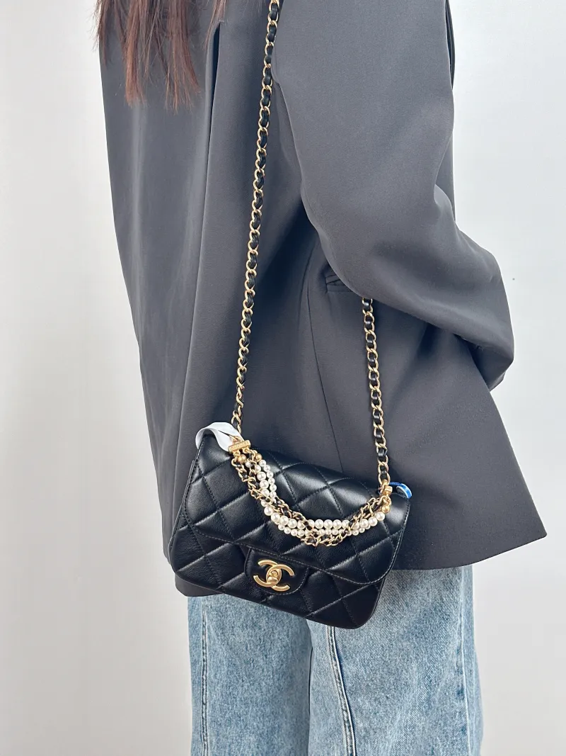Chanel Crossbody Bag Pearl Black Calfskin Small 19 × 6 × 13 cm — on-model view 1 of 3