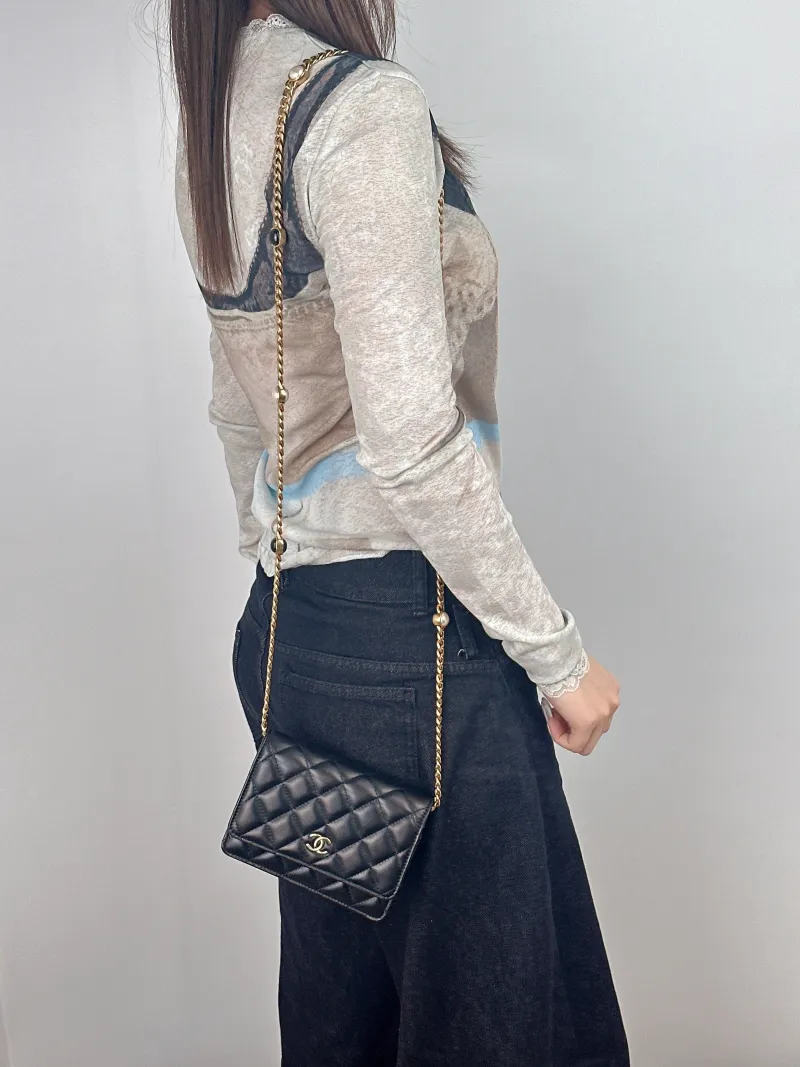 Chanel Crossbody Bag22b woc Black Lambskin15.5 × 4.5 × 11 cm — on-model view 2 of 2