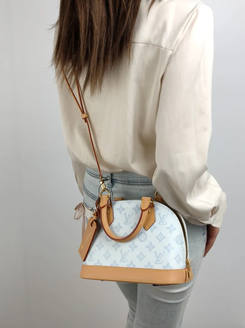 Louis Vuitton Top Handle Bag Alma BB Blue PVC BB 23.5 × 11.5 × 17.5 cm — on-model view 2 of 2