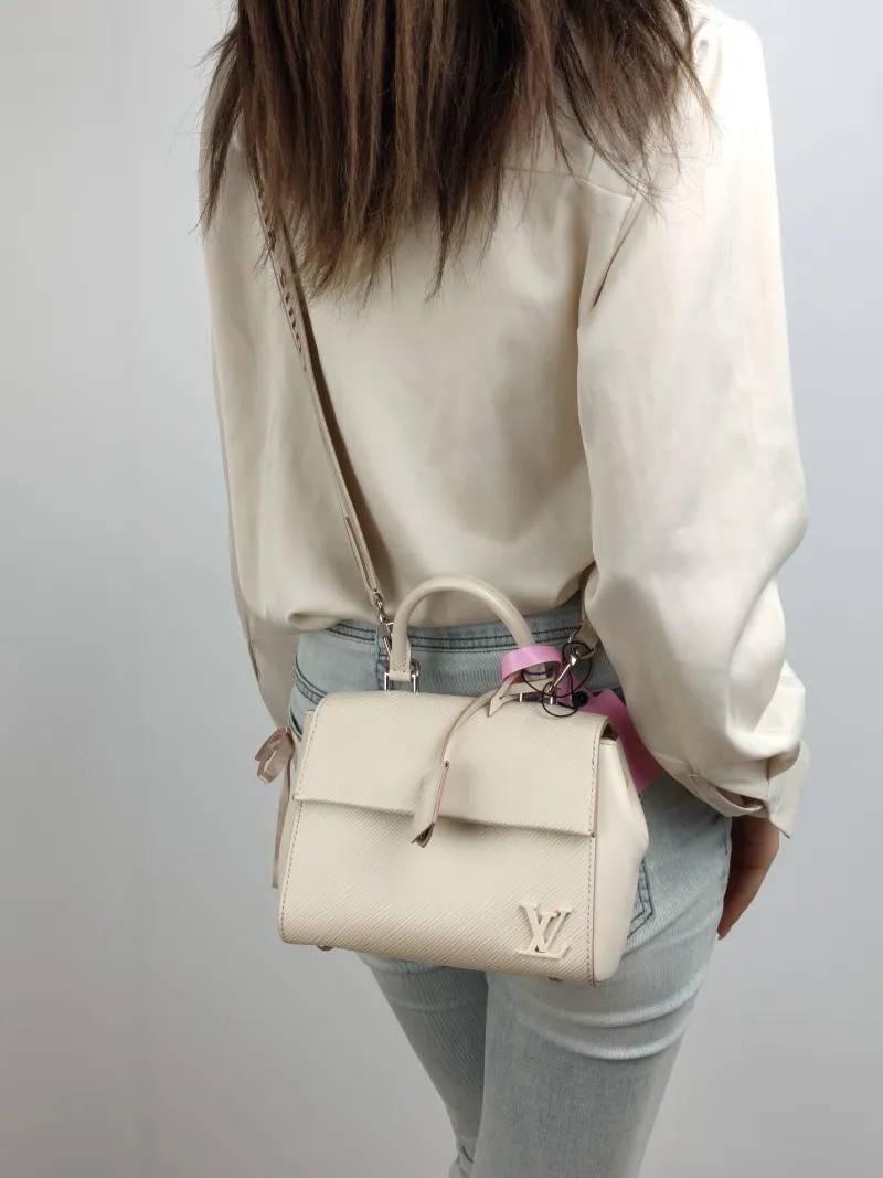 Louis Vuitton Crossbody Bag CLUNY White Epi Embossed Calfskin Mini 20 × 7.5 × 16 cm — on-model view 1 of 2