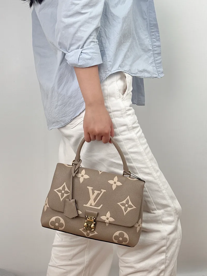Louis Vuitton Crossbody Bag MADELEINE Empreinte Embossed Calfskin Medium30 × 11 × 19.5 cm — on-model view 1 of 2