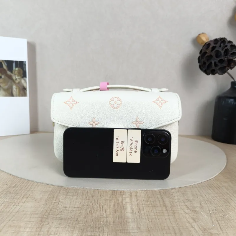 Louis Vuitton Crossbody Bag Pochette Métis East West White · Pink Monogram Empreinte Embossed Calfskin Small 21.5 × 6 × 13.5 cm — cover view 3 of 5