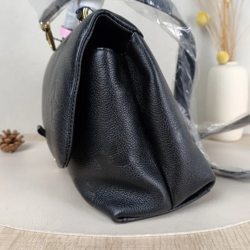 Louis Vuitton Crossbody Bag MADELEINE Black Monogram Empreinte Embossed Calfskin Medium 30 × 11 × 19.5 cm — detail view 2 of 11