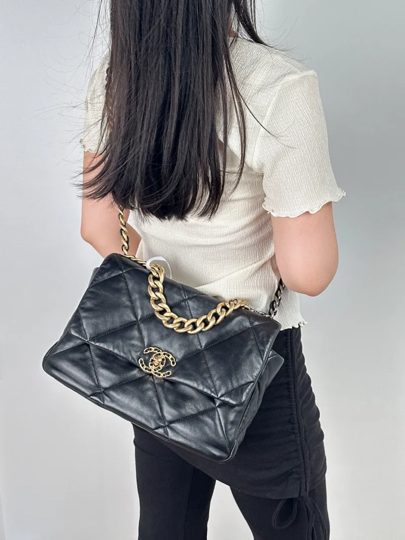 Chanel 19Bag Black Lambskin Medium30 × 10 × 20 cm — on-model view 1 of 2