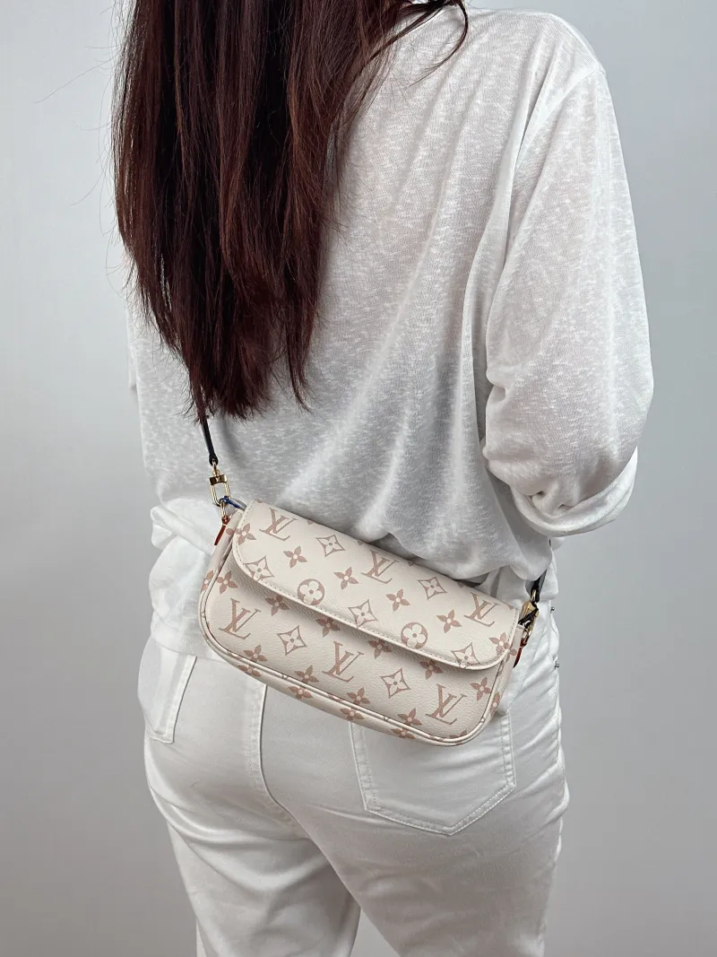 Louis Vuitton Crossbody Bag IVY · Beige PVC Small 23.5 × 4.3 × 12 cm — on-model view 1 of 2