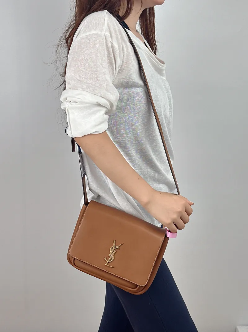SAINT LAURENT Crossbody Bag Niki Besace Messenger Bag Caramel Calfskin Small 21.5 × 9.5 × 16 cm — on-model view 1 of 2