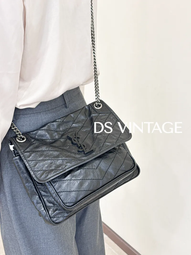 SAINT LAURENT Crossbody Bag Niki Black Waxed Leather Calfskin Medium28 × 8.5 × 20 cm — on-model view 2 of 6