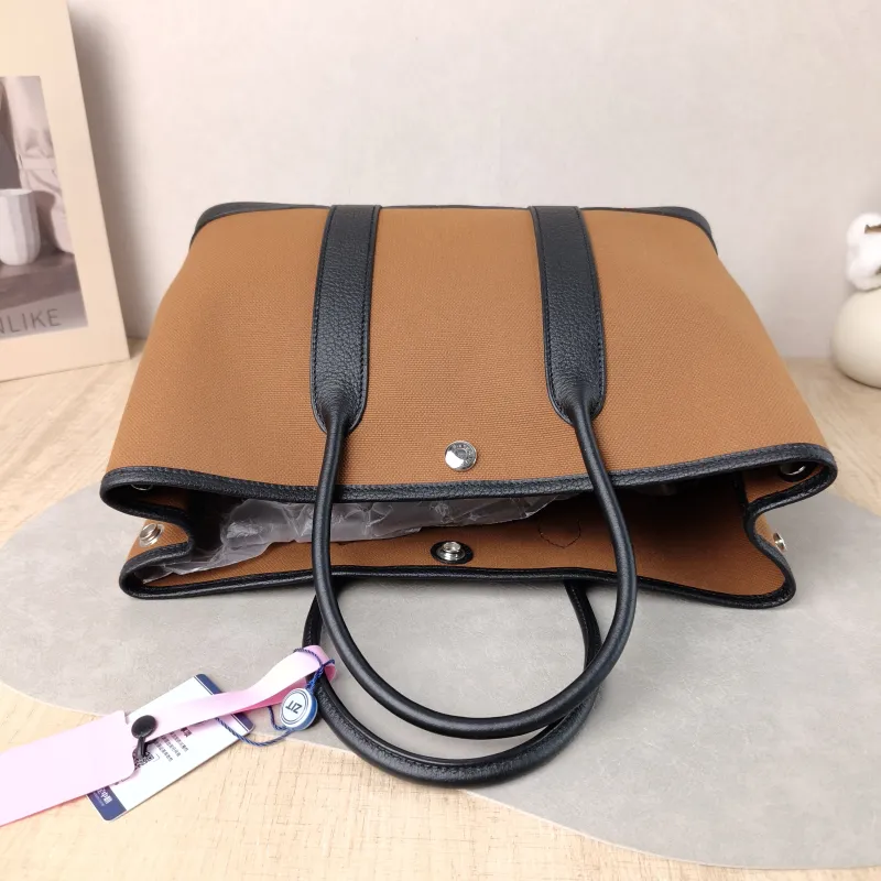 Hermès Top Handle Bag Garden Party 30 30 Brown Canvas · Negonda Calfskin Medium 30 × 13 × 21 cm B — detail view 1 of 9