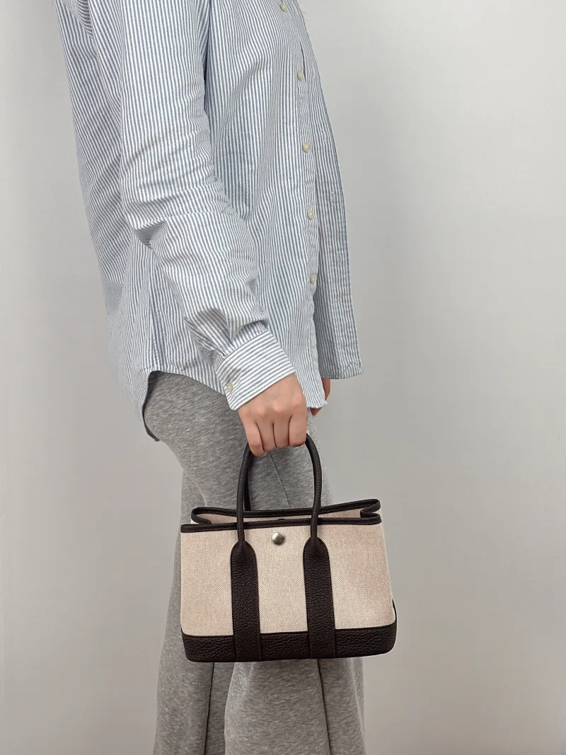 Hermès Top Handle Bag Neo Garden 23 Mini Canvas Mini 23 × 10 × 16 cm k — on-model view 2 of 2