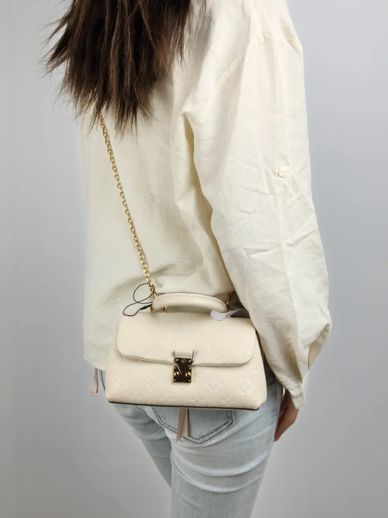 Louis Vuitton Crossbody Bag MADELEINE White Empreinte Embossed Calfskin nano 21 × 6 × 12.5 cm — on-model view 1 of 3