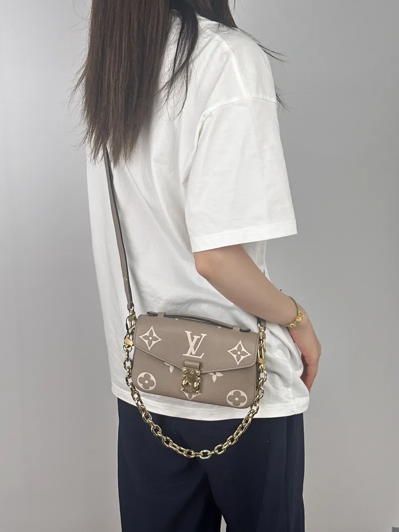 Louis Vuitton Crossbody Bag Pochette Métis East West Empreinte Embossed Calfskin Monogram Small21.5 × 6 × 13.5 cm — on-model view 3 of 3