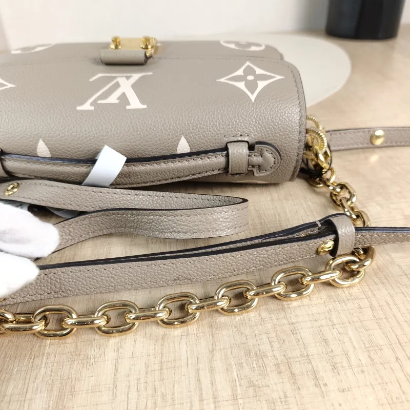 Louis Vuitton Crossbody Bag Pochette Métis East West Monogram Empreinte Embossed Calfskin Small 21.5 × 6 × 13.5 cm — detail view 10 of 12