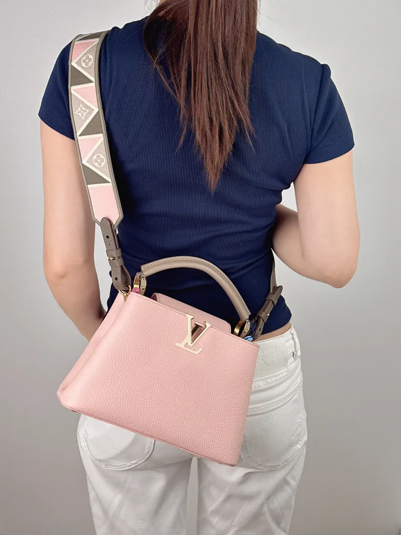 Louis Vuitton Top Handle Bag Capucines Pink Calfskin BB 27 × 9 × 17.5 cm — on-model view 1 of 3