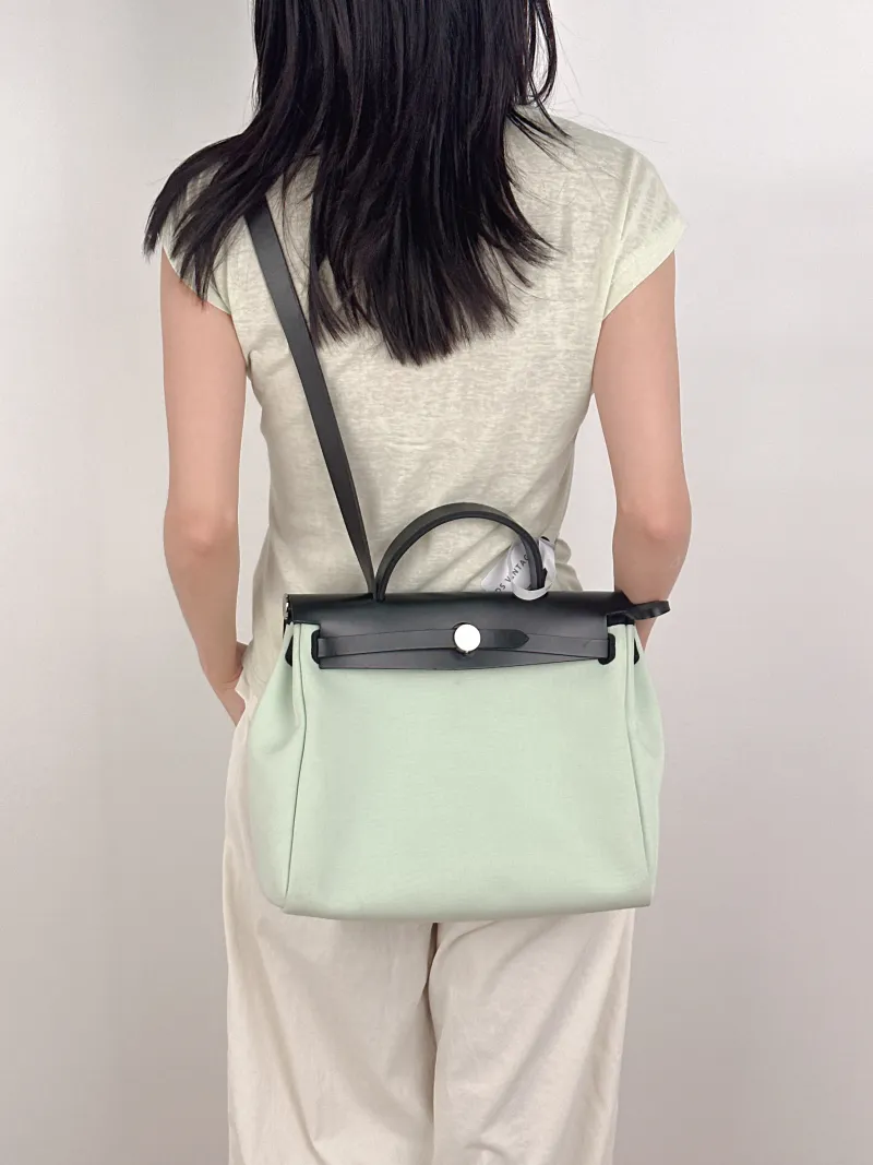 Hermès Shoulder Bag Herbag 31 Green Canvas Medium31 × 10 × 25 cm — on-model view 1 of 3